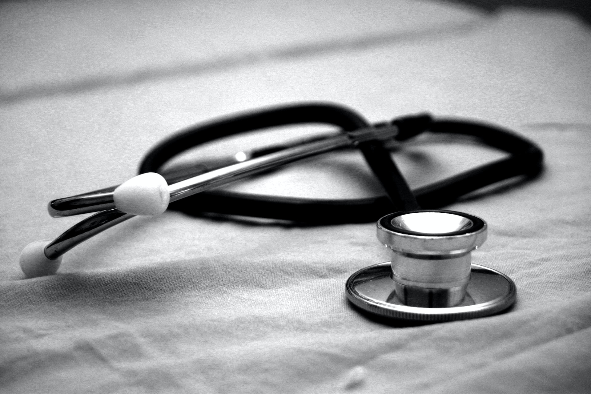 stethoscope-black-and-white-on-table