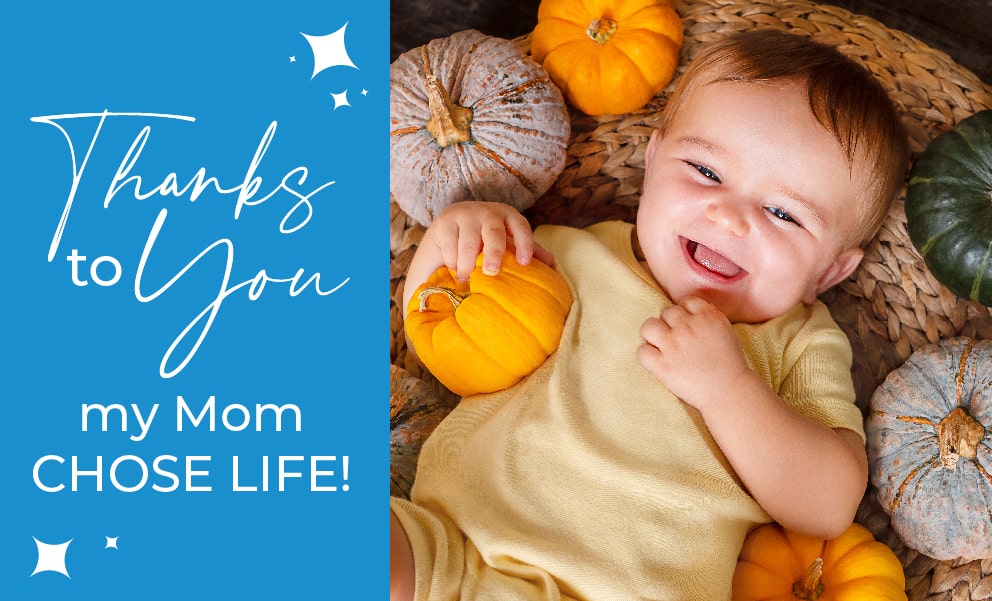 Thanks to you my mom chose life_bab on woven rug looking up surrounded by multi colored pumpkins